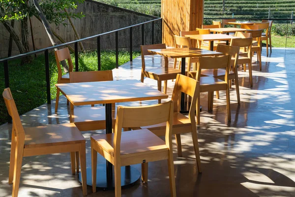 empty wood table and chair in restaurant