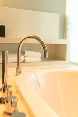 close-up tap on bath tub in bathroom
