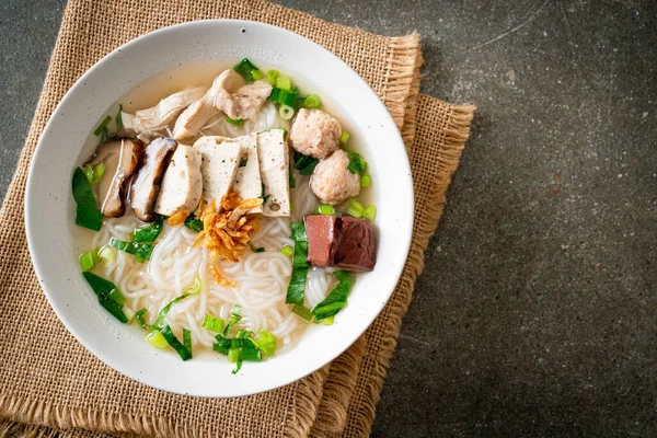 stock image Vietnamese Rice Noodles Soup with Vietnamese Sausage served vegetables and crispy onion - Asian food style