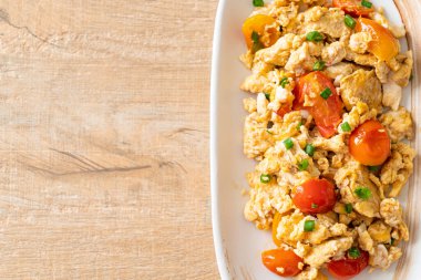 stir-fried tomatoes with egg on plate - healthy food style