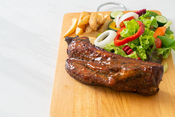 grill barbecue pork spare ribs with vegetables