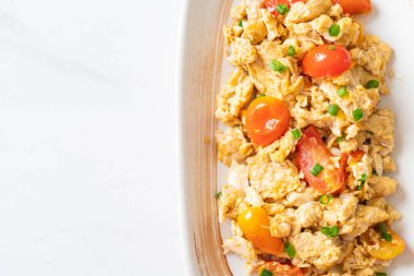 stir-fried tomatoes with egg on plate - healthy food style