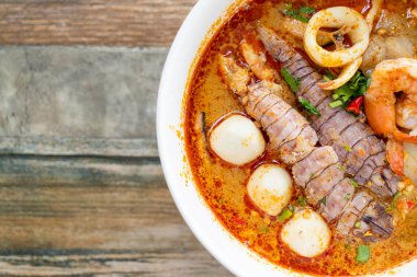 spicy seafood noodles bowl in Thai style - Tom Yum Noodles