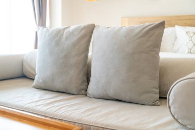 comfortable pillows on end of bed sofa decorate in bedroom