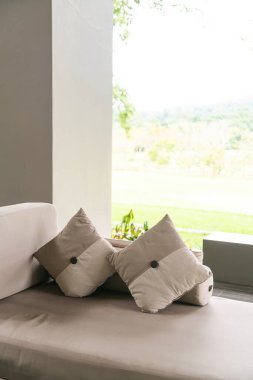 comfortable pillows on sofa in relaxing area