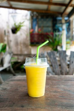 mango smoothies in plastic take away glass