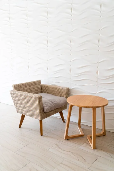 empty wicker sofa with table with white wall