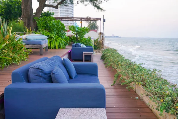 empty outdoor sofa with sea beach view
