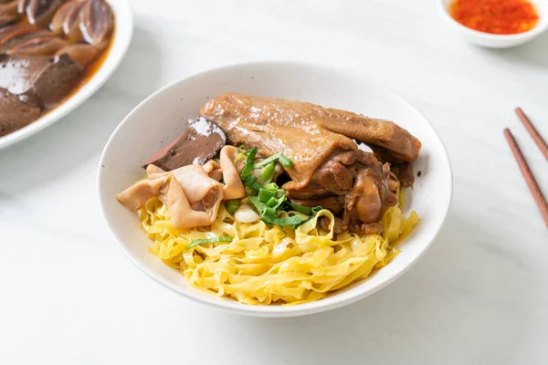 stock image Egg noodles served dry with braised duck  - Asian food style