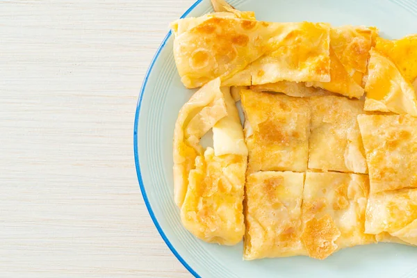 stock image fried roti with egg and sweetened condensed milk