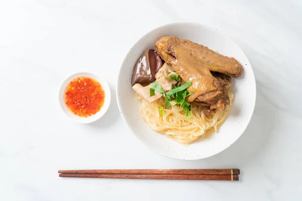 stock image dried noodles with braised duck in white bowl - Asian food style