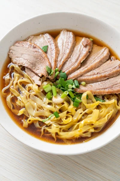 stock image egg noodles with stewed duck in brown soup - Asian food style