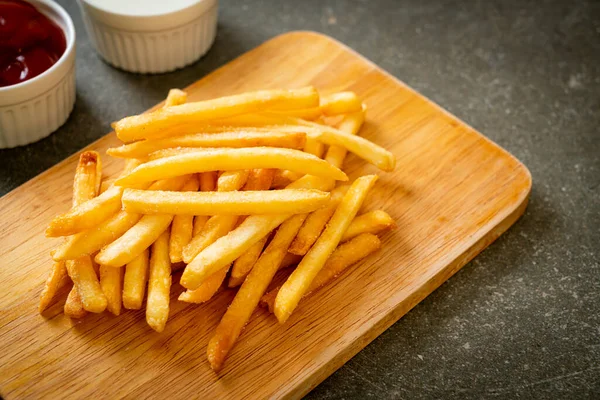 stock image French fries or potato chips with sour cream and ketchup