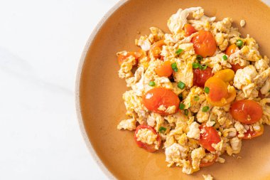 stir-fried tomatoes with egg on plate - healthy food style