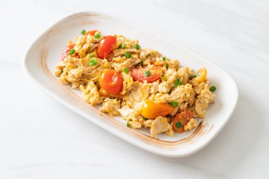 stir-fried tomatoes with egg on plate - healthy food style