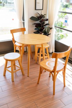 empty wood table and chair in coffee shop