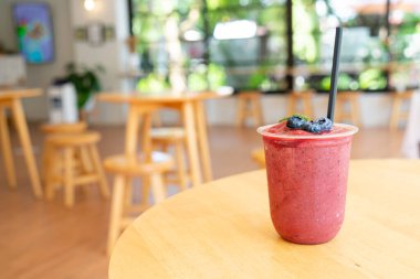mixed berry smoothies in take away glass