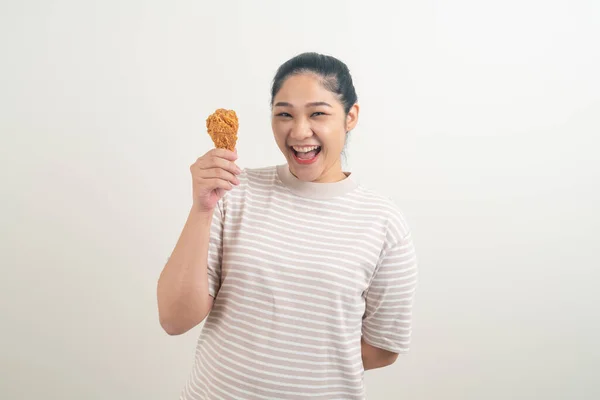 stock image portrait Asian woman with fried chicken on hand