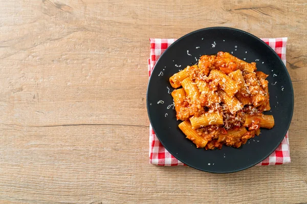 stock image Bolognese rigatoni pasta with cheese - traditional Italian pasta