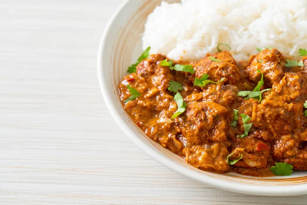 Stock image chicken tikka masala with rice on plate - Indian food style