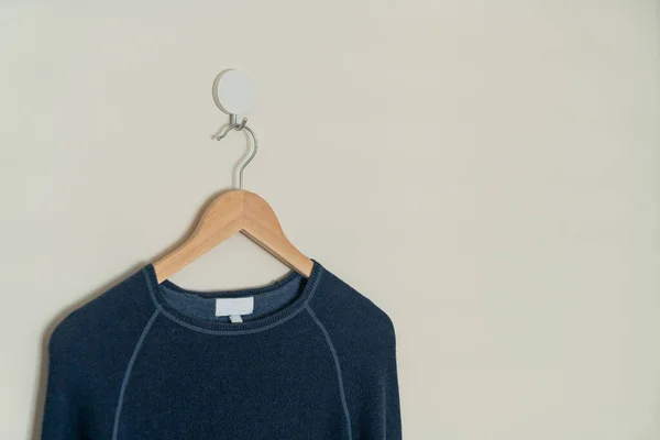 Navy Sweater Hanging Wood Hanger Wall — 图库照片
