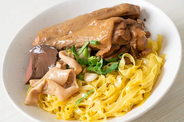 stock image Egg noodles served dry with braised duck  - Asian food style