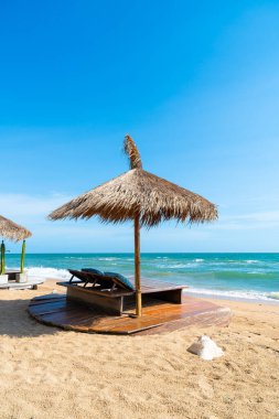 beach chair and umbrella with sea beach background - Holidays and vacation concept