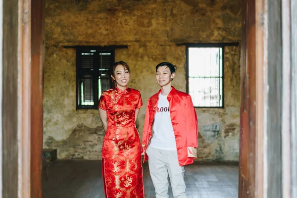 stock image Happy young Asian couple love in Chinese traditional dresses - Red is the main color of the traditional festive that including wedding in China.