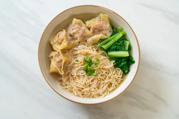 stock image egg noodles with pork wonton soup or pork dumplings soup and vegetable - Asian food style