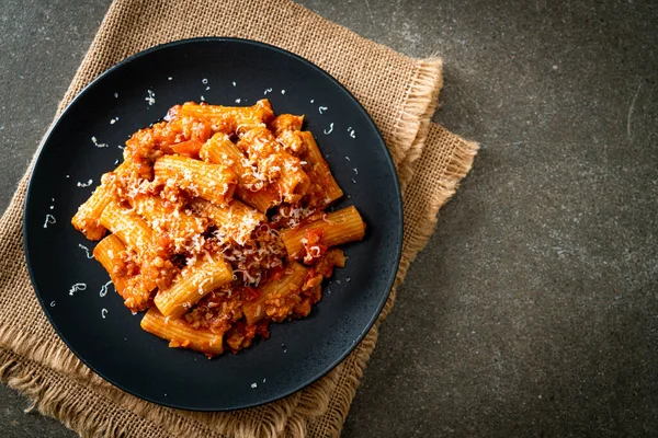 stock image Bolognese rigatoni pasta with cheese - traditional Italian pasta