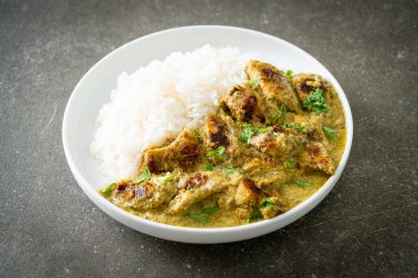 Afghani chicken in green curry or Hariyali tikka chicken hara masala with rice - Asian food style
