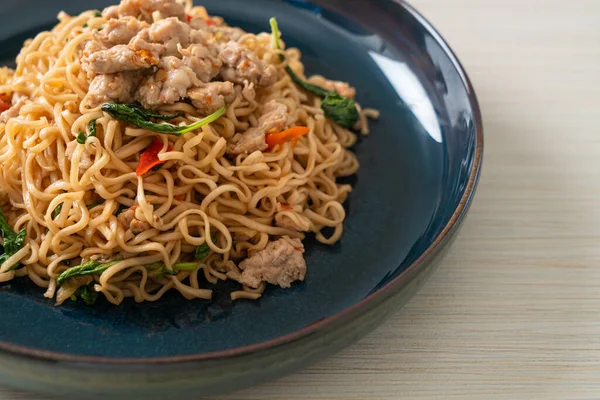 stock image homemade stir-fried instant noodles with Thai basil and minced pork - Thai food style