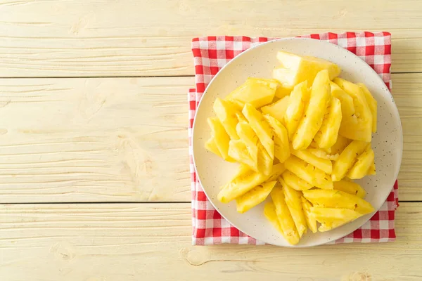 Stock image fresh pineapple sliced on white plate