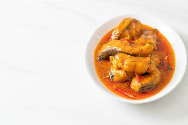 Redtail Catfish Fish in Dried Red Curry Sauce that called Choo Chee or a king of curry cooked with fish served with a spicy sauce