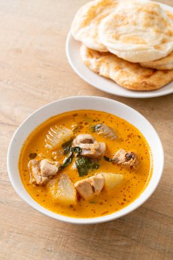 Chicken curry soup with roti or naan with chicken tikka masala - Asian food style