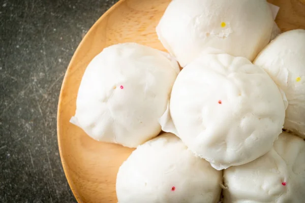 stock image stuffed steamed bun on wood plate - Chinese food style