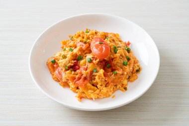 Stir-fried tomatoes with egg or Scrambled eggs with tomatoes - healthy food style