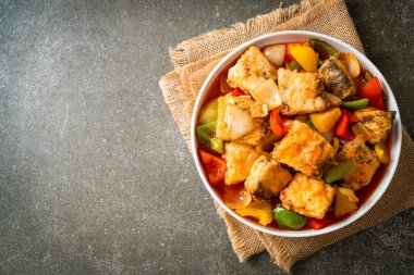 fish stew with tomato and pepper on plate