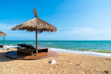 beach chair and umbrella with sea beach background - Holidays and vacation concept