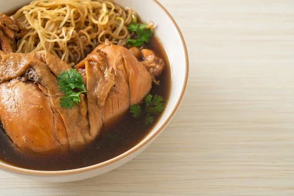 stock image Noodles with Braised Chicken in Brown Soup Bowl - Asian food style