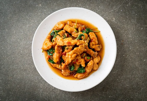 stock image stir-fried fried fish with basil and chili in thai style - Asian food style