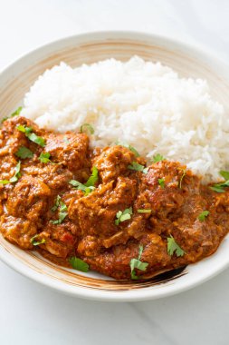 chicken tikka masala with rice on plate - Indian food style