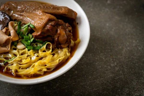 stock image egg noodles with stewed and braised duck in brown soup - Asian food style