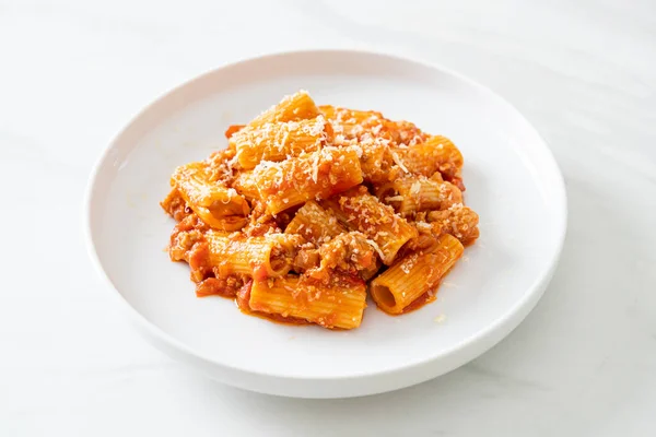 stock image Bolognese rigatoni pasta with cheese - traditional Italian pasta