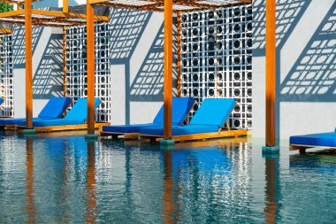 pool bed around swimming pool - Holidays and vacation concept