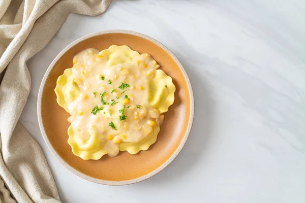 stock image ravioli pasta with corn cheese sauce on plate