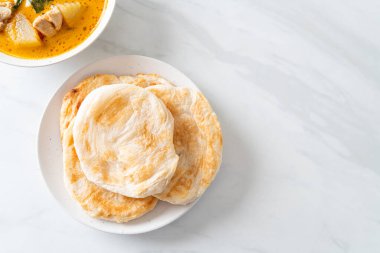 Chicken curry soup with roti or naan with chicken tikka masala - Asian food style