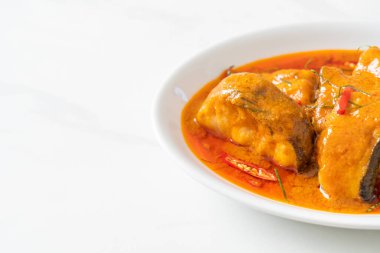 Redtail Catfish Fish in Dried Red Curry Sauce that called Choo Chee or a king of curry cooked with fish served with a spicy sauce