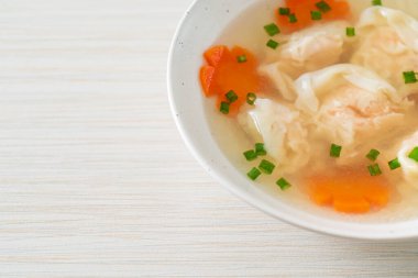 shrimp dumpling soup in white bowl - Asian food style