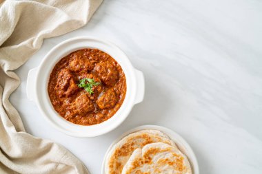 chicken tikka masala spicy curry meat food with roti or naan bread - Indian food style